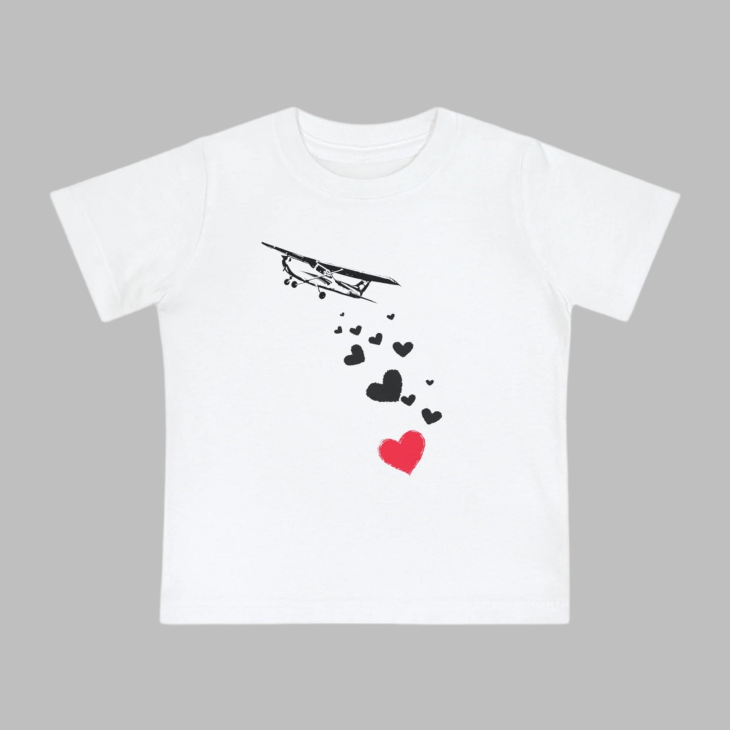 Baby tee featuring airplanes and hearts