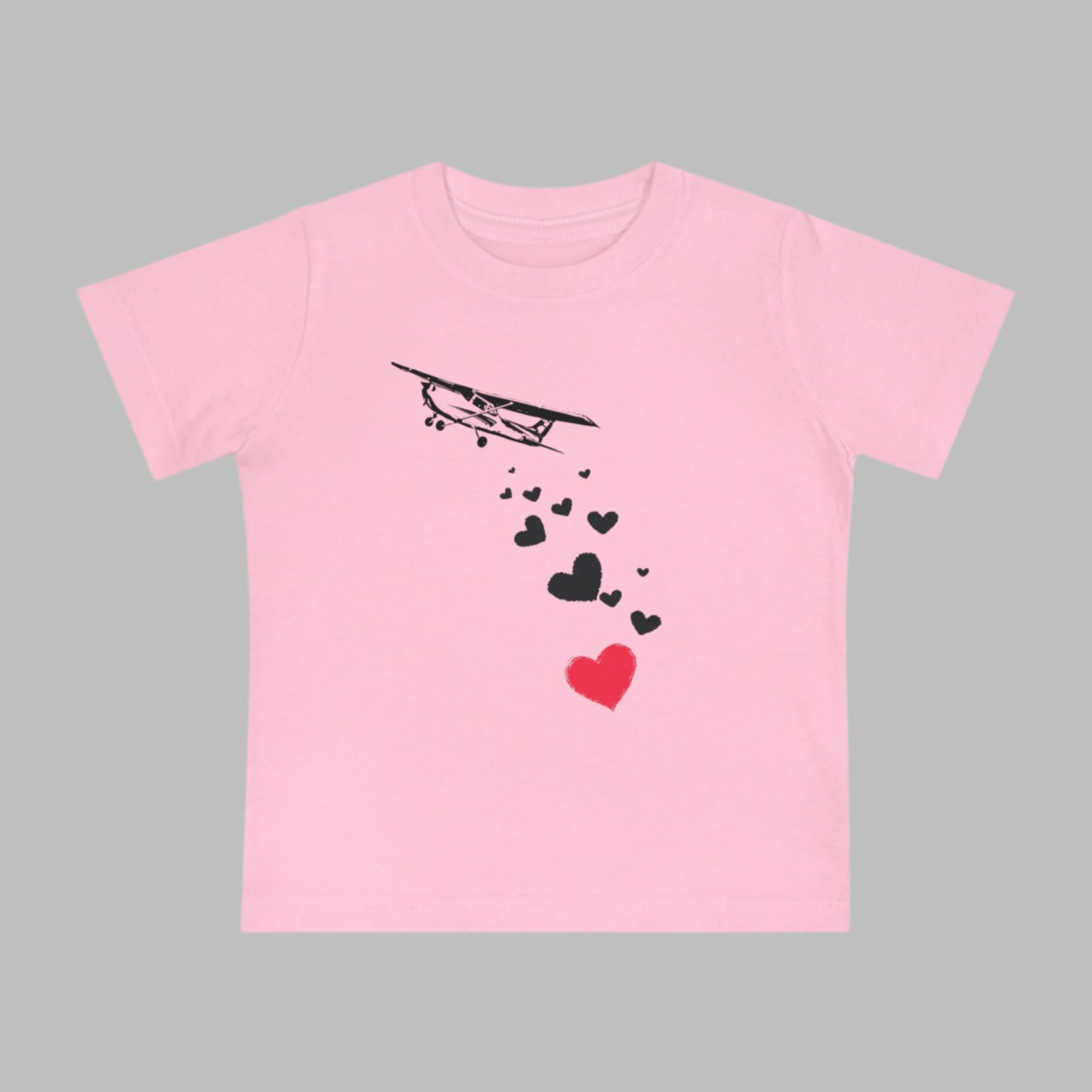 Baby tee featuring airplanes and hearts