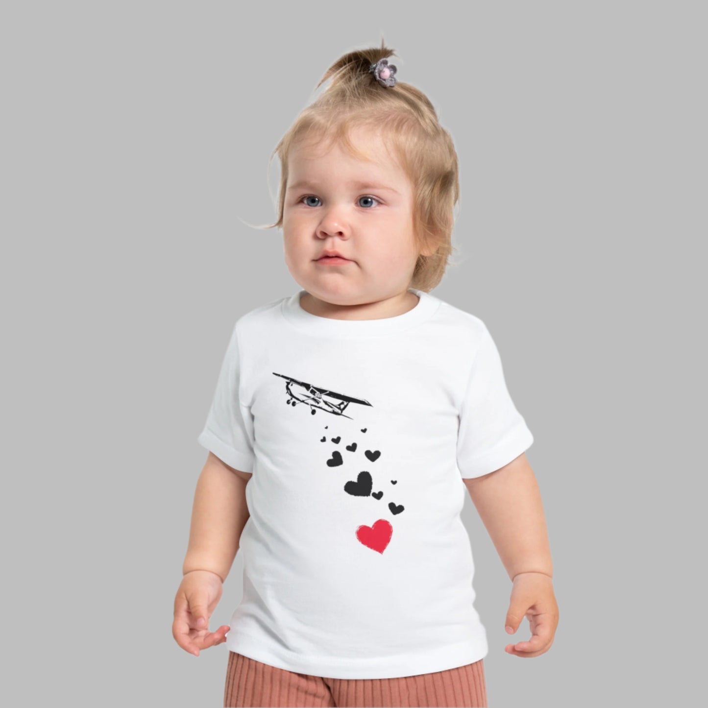 Baby wearing airplane shirt