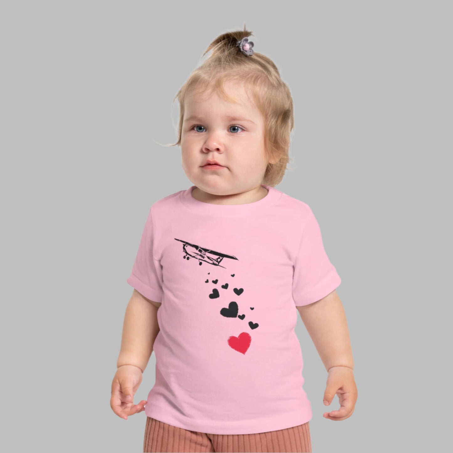 Baby wearing airplane tee