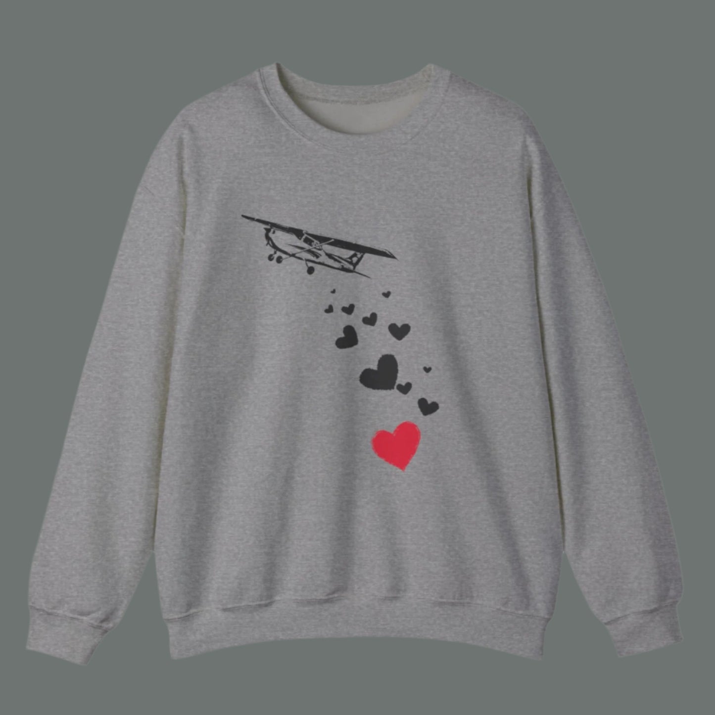 Sweatshirt of airplane dropping hearts