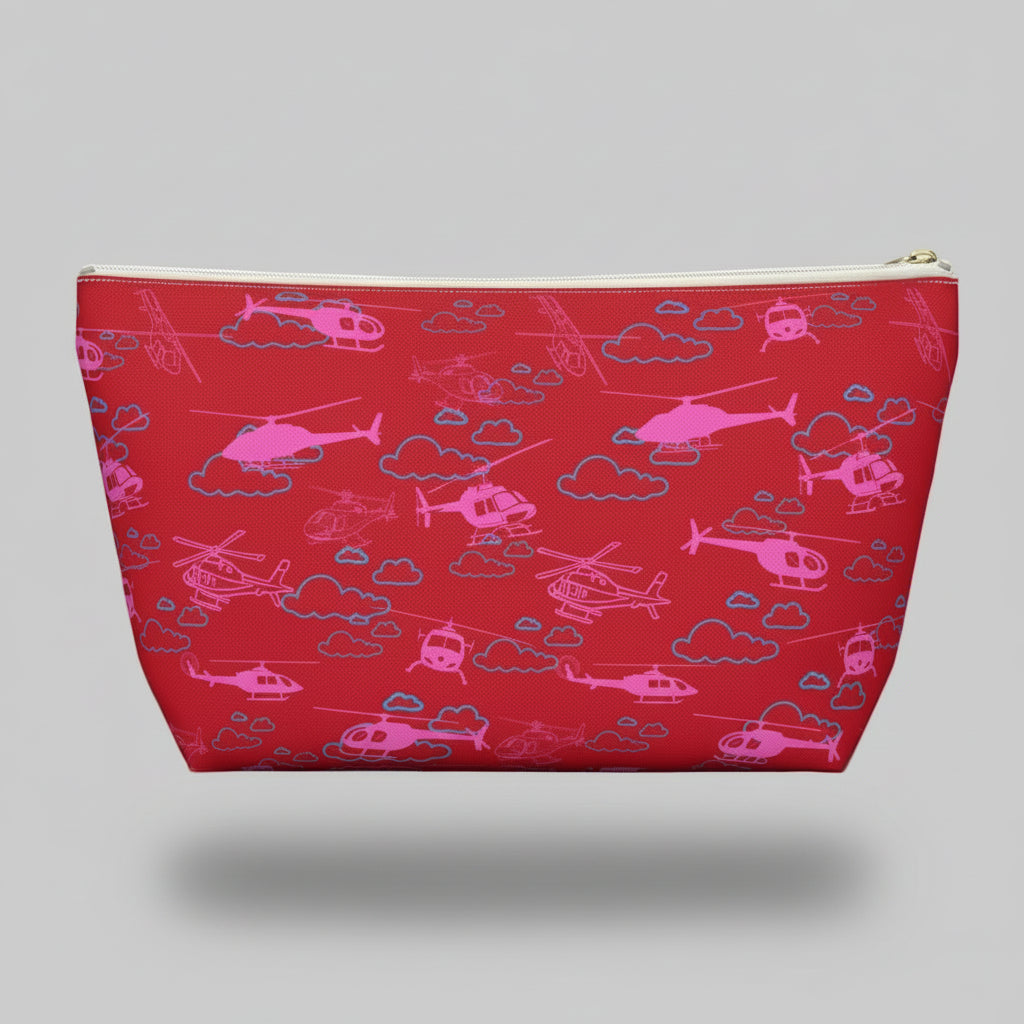 Red pouch with pink helicopter pattern on a white background