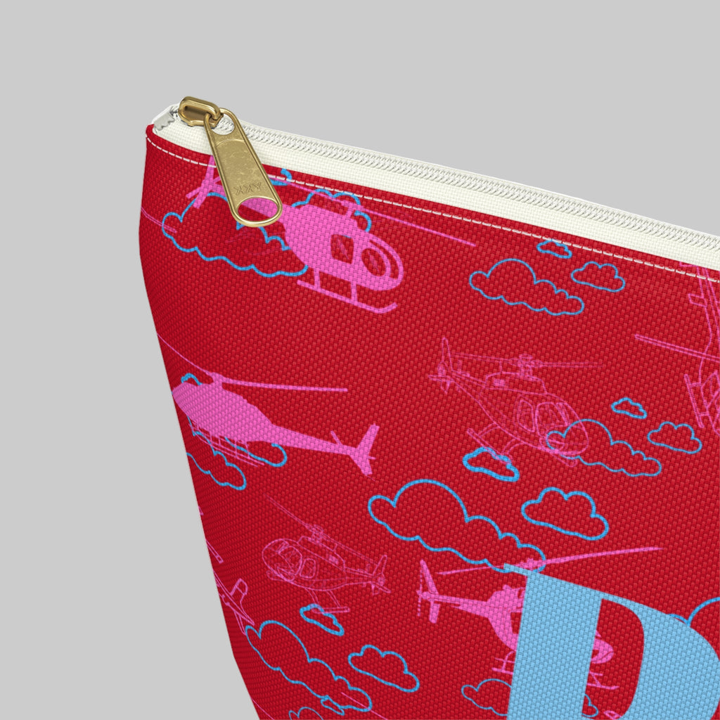 Red pouch with helicopter and cloud pattern on a white background