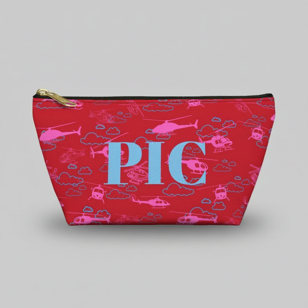 Red pouch with pink helicopter pattern and 'PIC' text on a white background
