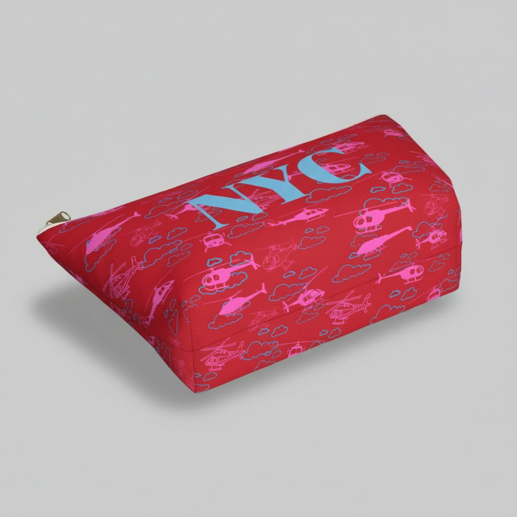 Red pouch with pink helicopter pattern and blue text on a white background
