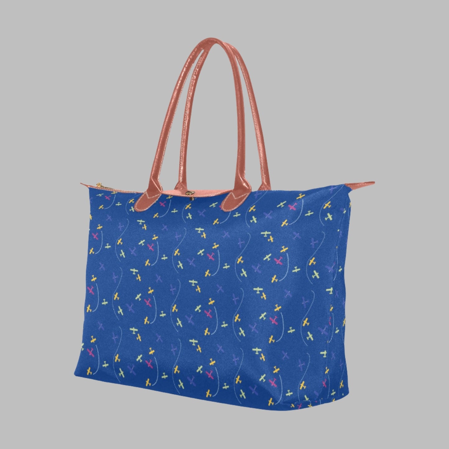 blue handbag with rolled straps and airplane design