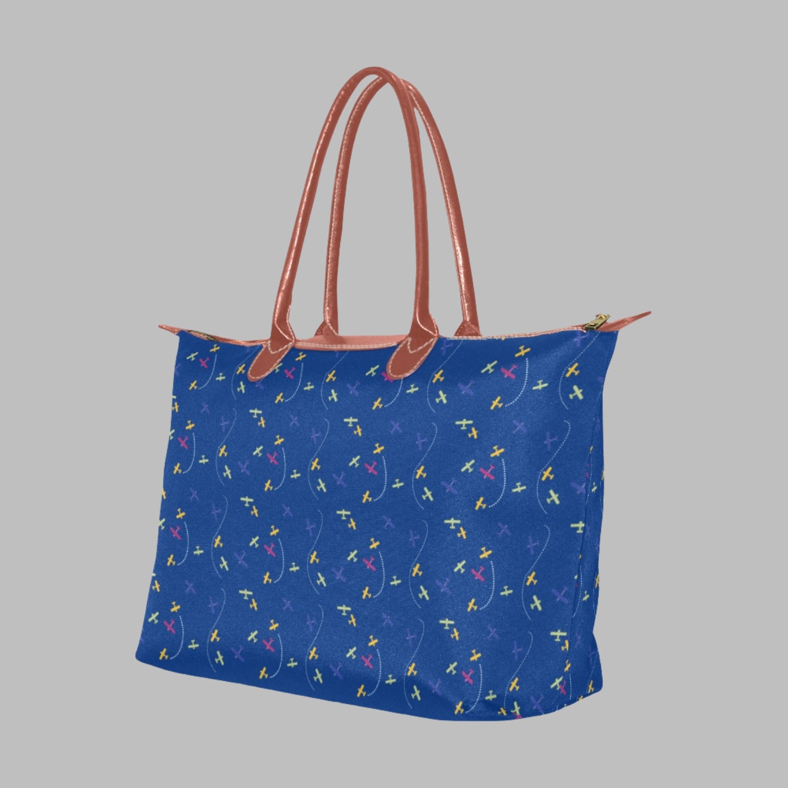 blue handbag with rolled straps and airplane design