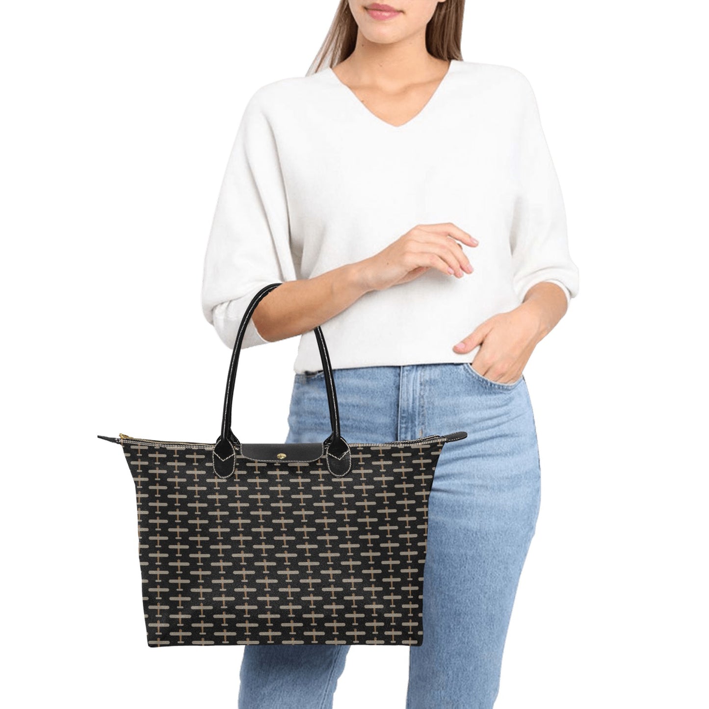 black handbag with beige airplane pattern design