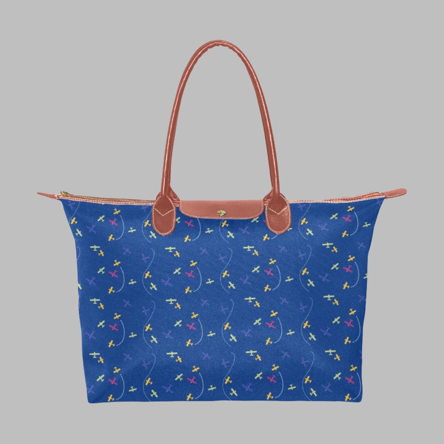 blue handbag with rolled straps and airplane design