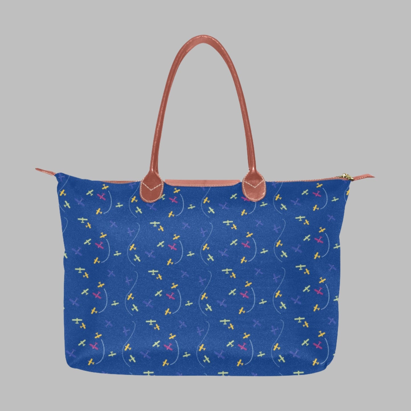 blue handbag with rolled straps and airplane design